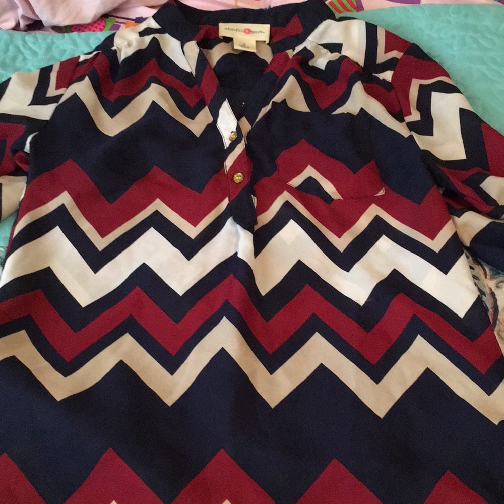 A formal multicolored chevron printed blouse